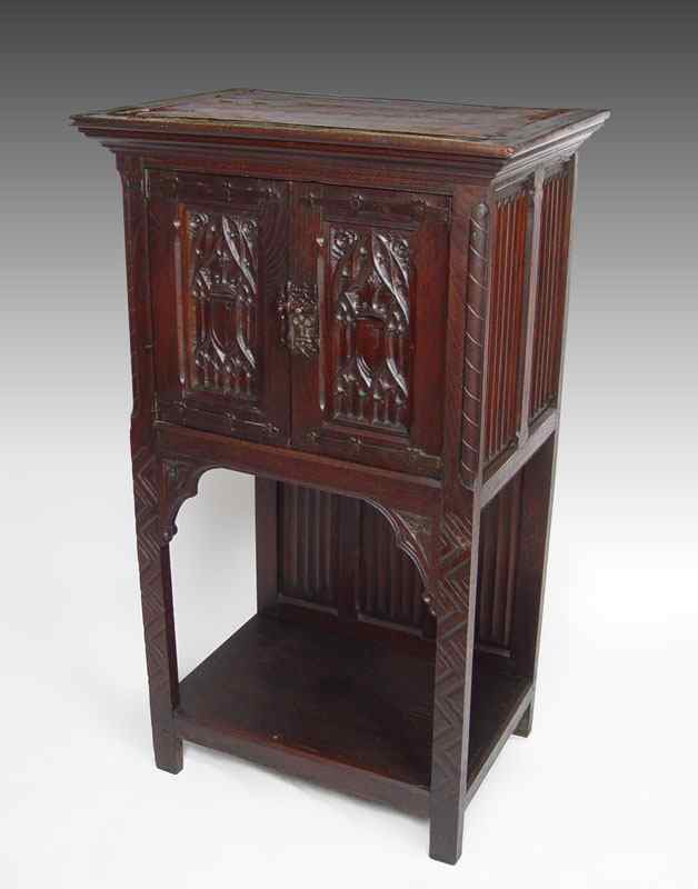 Appraisal: JACOBEAN STYLE GOTHIC OAK CABINET Door cabinet on carved legs