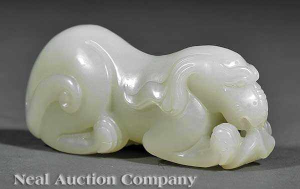 Appraisal: A Chinese White Jade Figure of a Mythical Beast carved