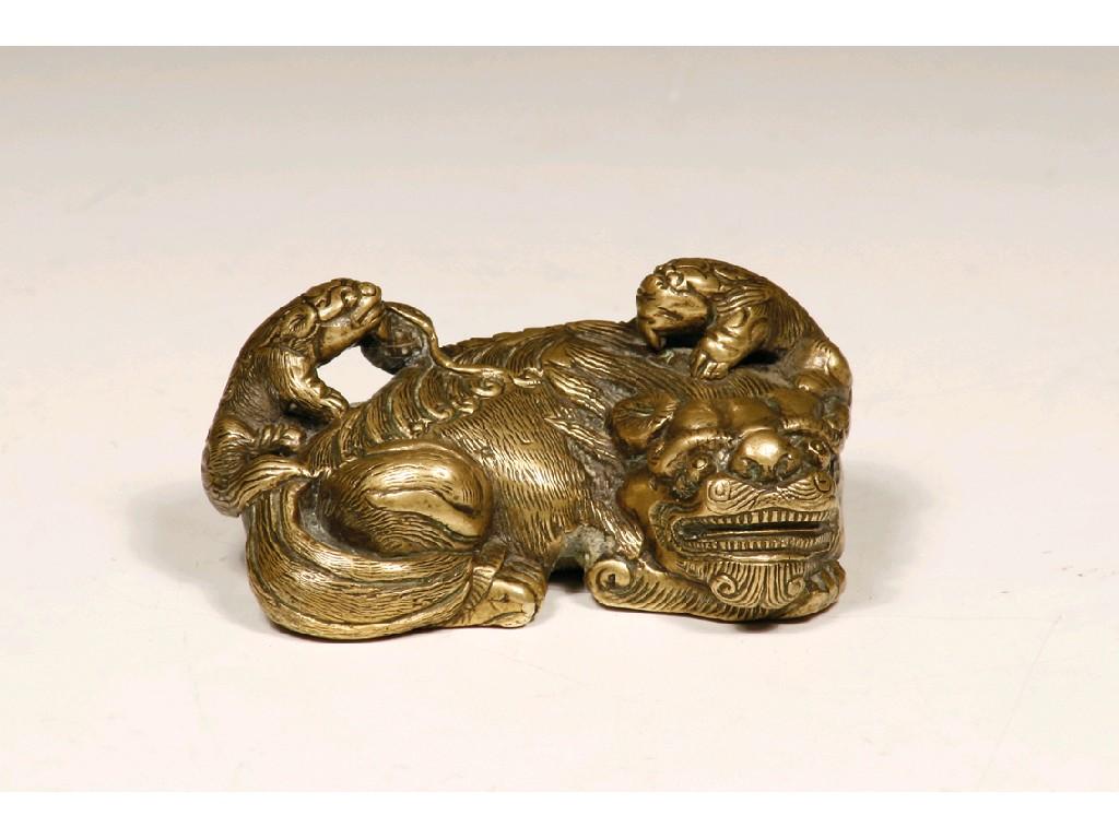 Appraisal: A CHINESE BRONZE SCROLL WEIGHT modelled as a buddhistic lion