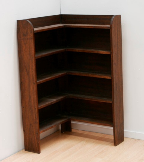 Appraisal: An oak open corner bookshelf