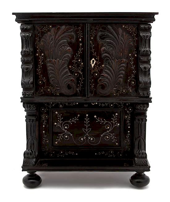 Appraisal: A Continental Diminutive Carved and Inlaid Cabinet Height x width