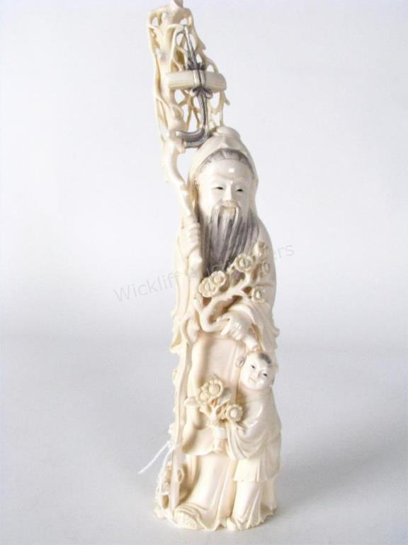 Appraisal: Oriental Carved Figure depicting a holy man in robes with