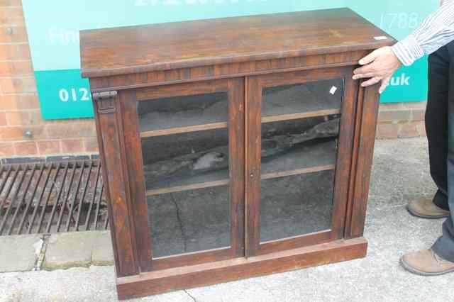 Appraisal: A TH CENTURY ROSEWOOD SIDE CABINET the two glazed doors