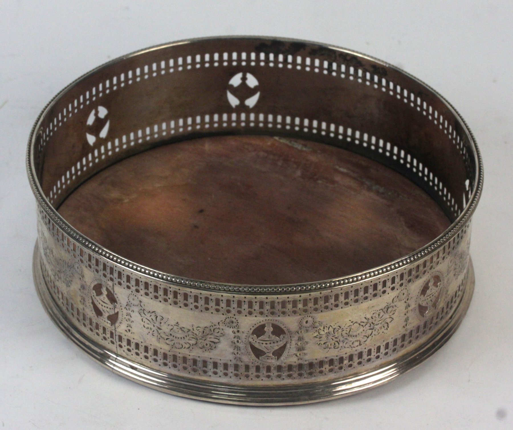 Appraisal: A Georgian silver decanter coaster marks rubbed of circular form