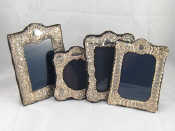 Appraisal: Four modern hallmarked silver faced photo frames with strut backs