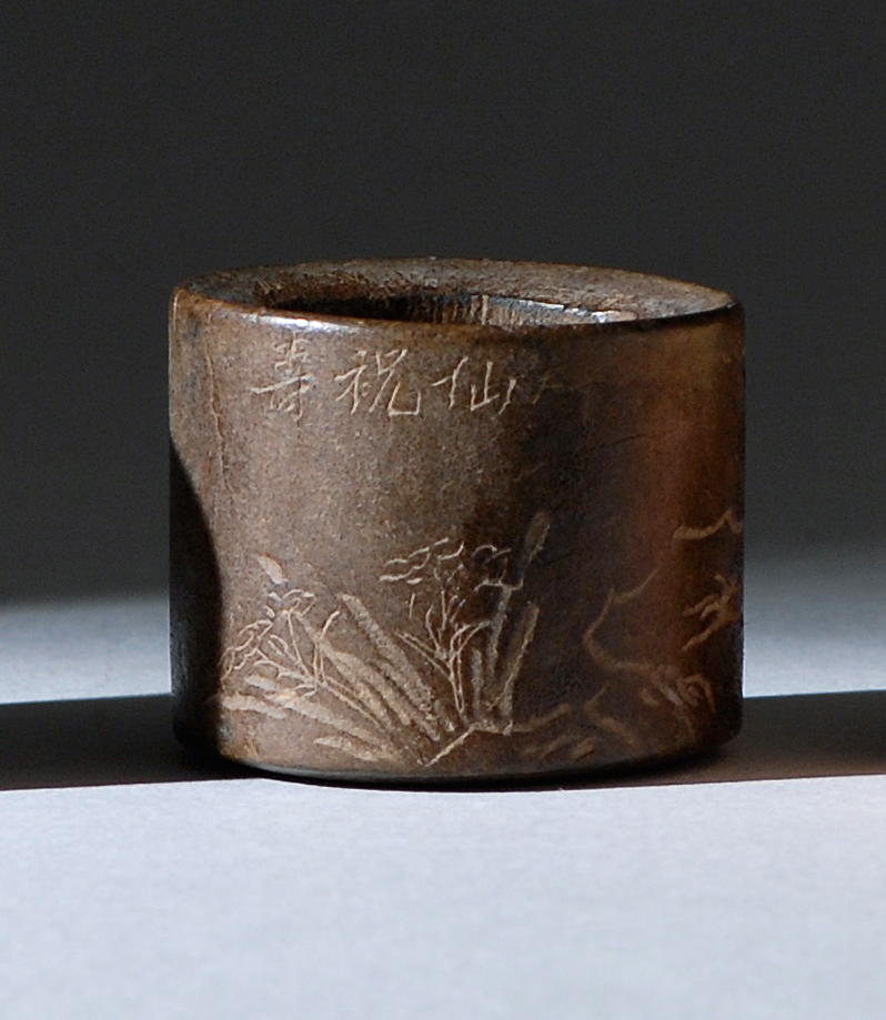 Appraisal: ENGRAVED WOOD SCHOLAR'S RING th CenturyIn a bamboo and rockery