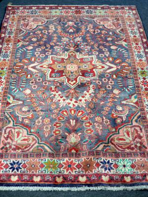 Appraisal: A Lilihan rug the pale blue ground with central medallion