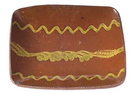 Appraisal: PENNSYLVANIA GLAZED REDWARE LOAF PAN NINETEENTH CENTURY Covered in brick-red