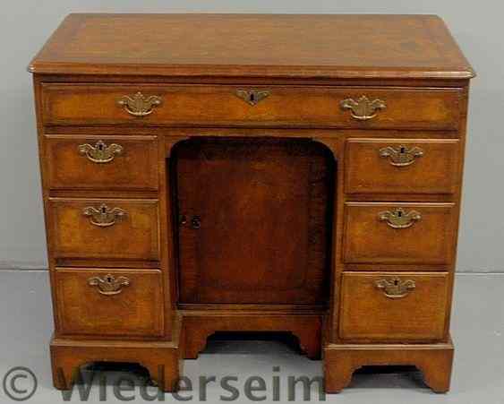 Appraisal: Georgian style burl wood knee-hole desk with a center door