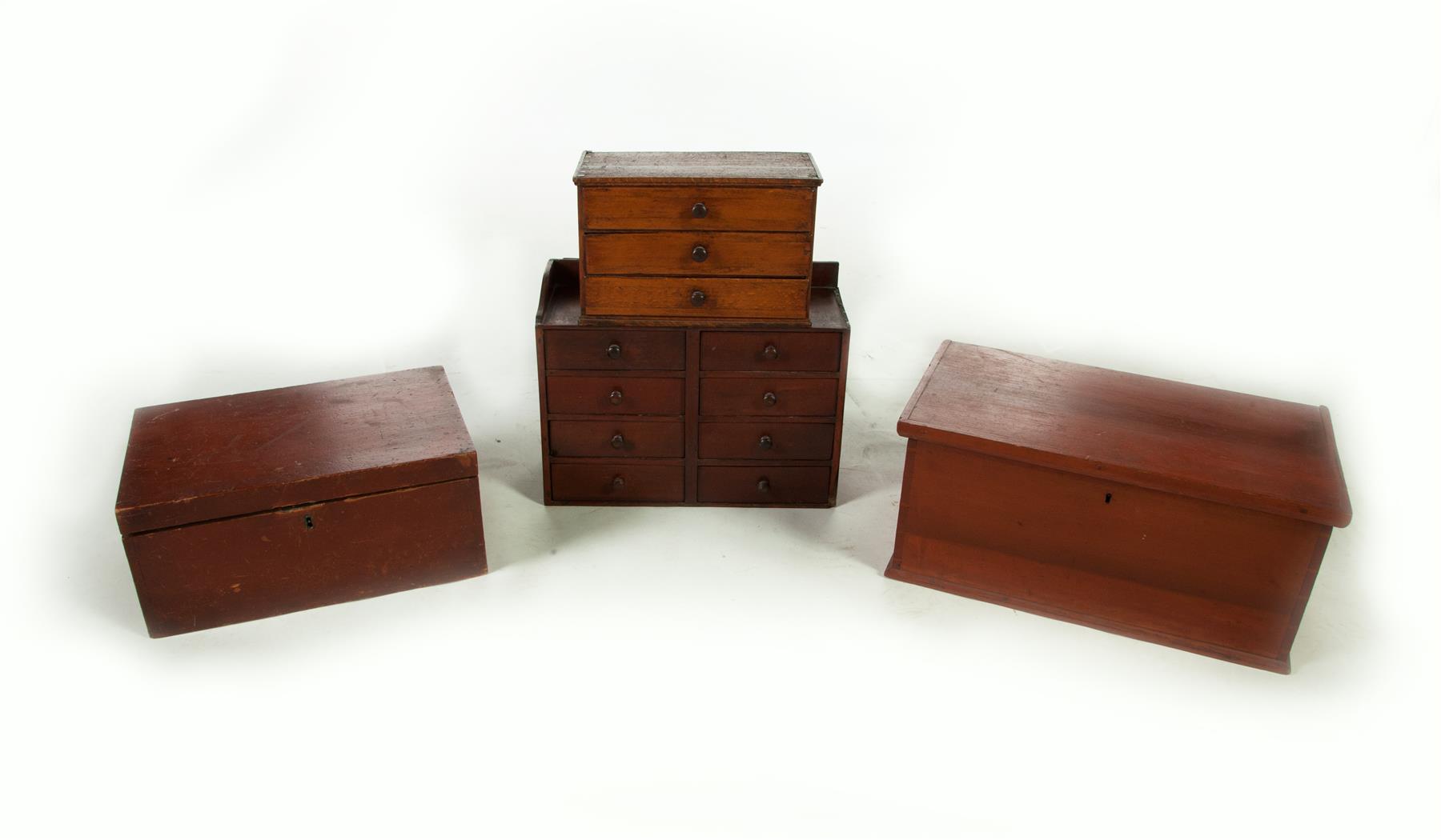 Appraisal: FOUR WOODEN CASE ITEMS American th century Three-drawer miniature chest