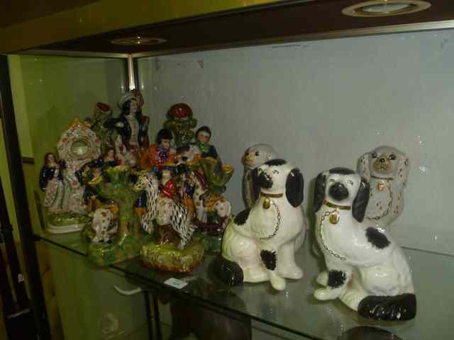 Appraisal: A COLLECTION OF REPRODUCTION STAFFORDSHIRE FIGURES including two pairs of