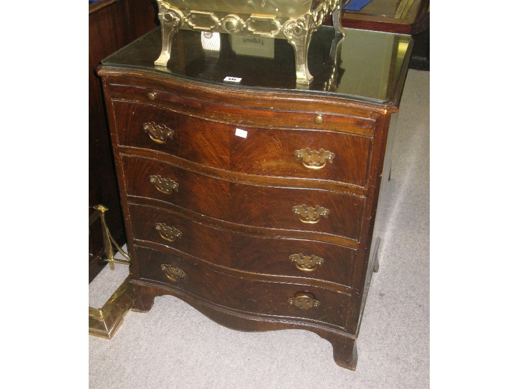 Appraisal: Mahogany serpentine front drawer chest with brushing slide