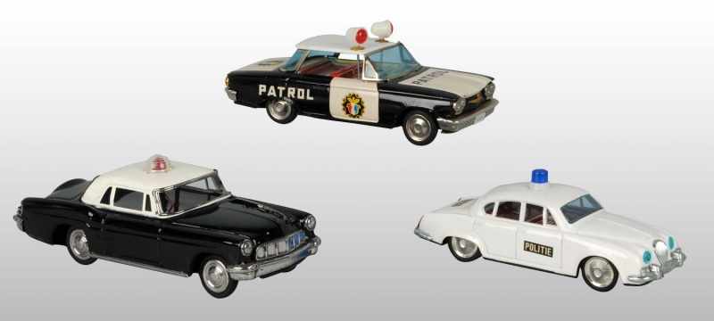 Appraisal: Lot of Tin Police Patrol Cars Description Japanese Working Includes