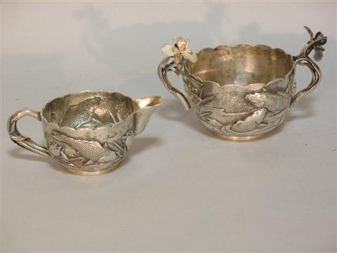 Appraisal: JAPANESE SILVER REPOUSSE CREAM PITCHER AND OPEN SUGAR BOWL Meiji