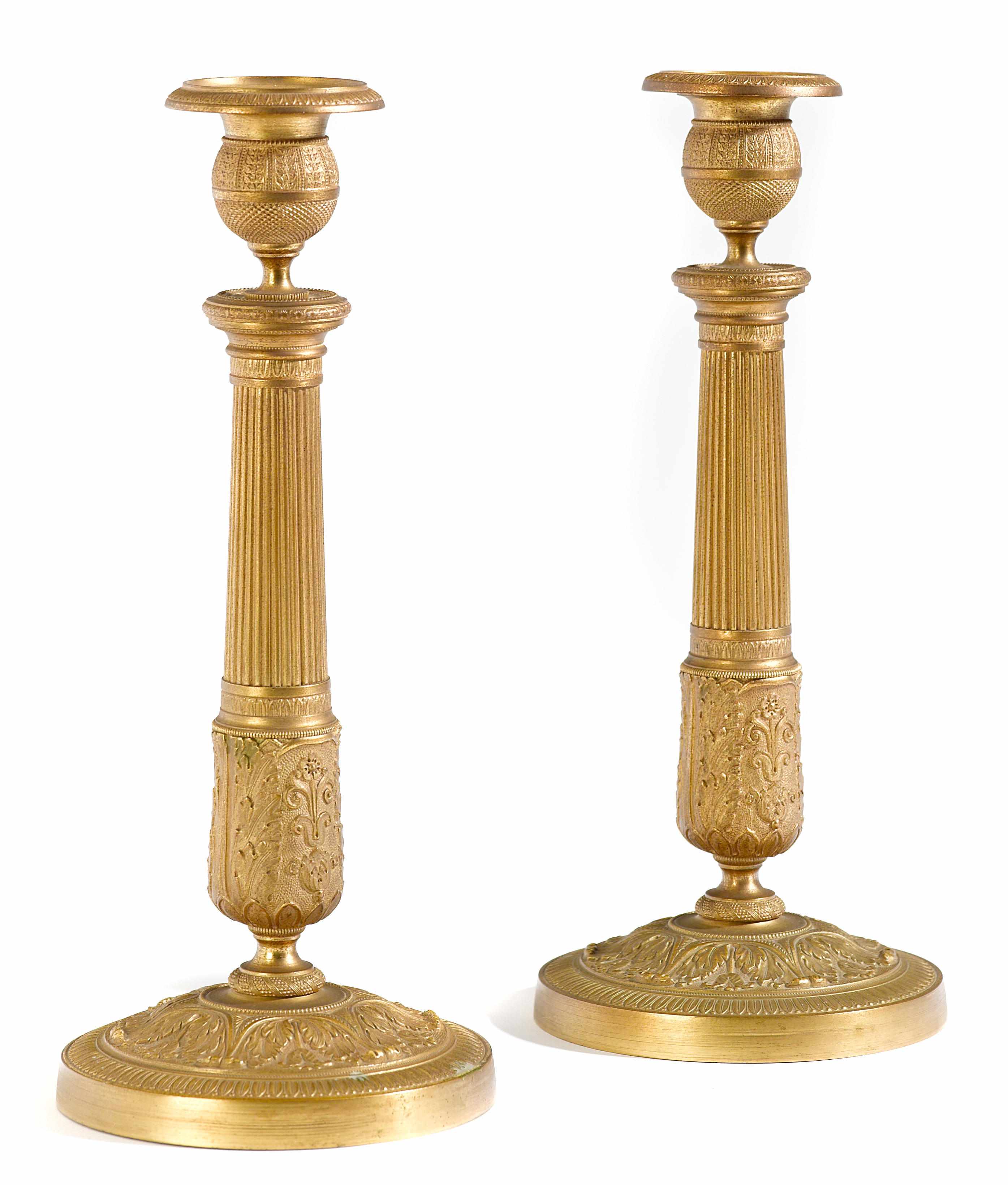 Appraisal: A pair of Empire gilt bronze candlesticks early th century