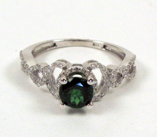 Appraisal: GREEN TSAVORITE AND DIAMOND RING with appraisal The k white