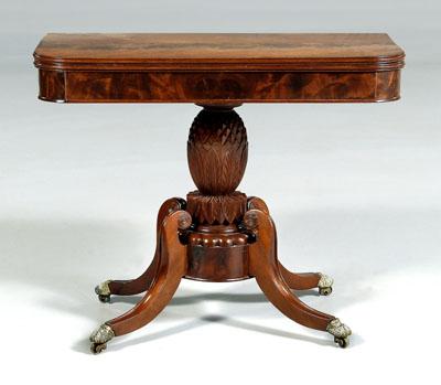 Appraisal: Classical carved mahogany games table fold-over top on artichoke and