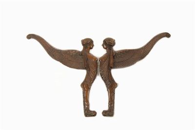 Appraisal: A pair of French carved walnut wall mounts modelled as