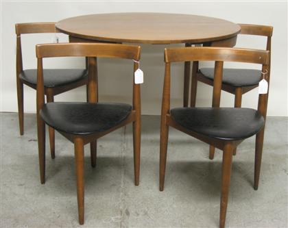 Appraisal: Extending dining table with four chairs after hans olsen danish