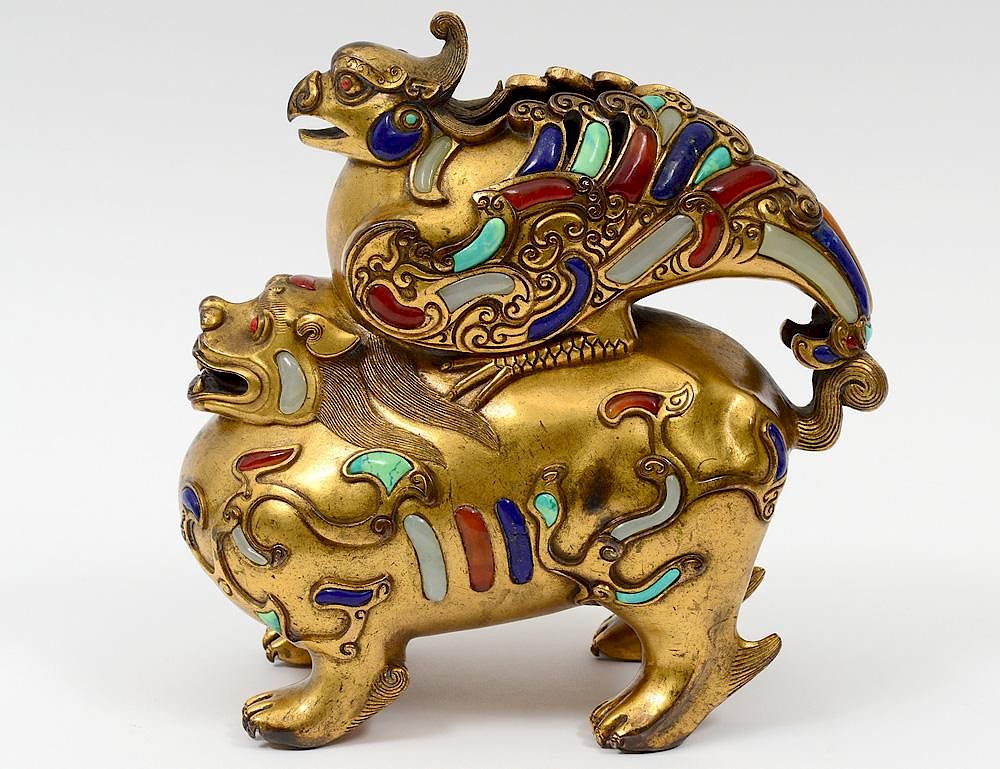 Appraisal: GILT BRONZE FIGURE OF A MYTHICAL BEAST Chinese Standing four