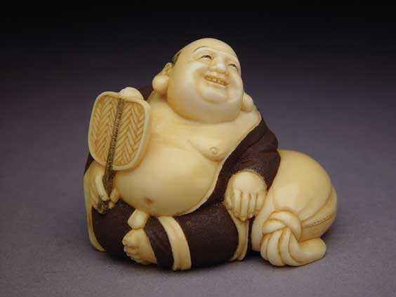 Appraisal: CARVED IVORY NETSUKE Contemporary carved ivory netsuke of a resting