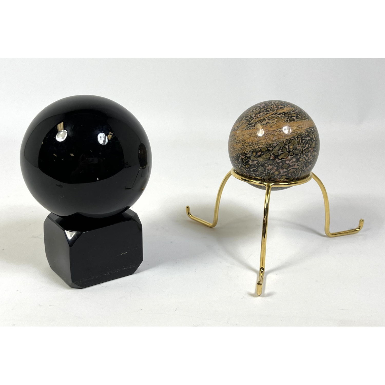 Appraisal: Two Polished Stone Spheres on Stands Sculpture Dimensions H inches