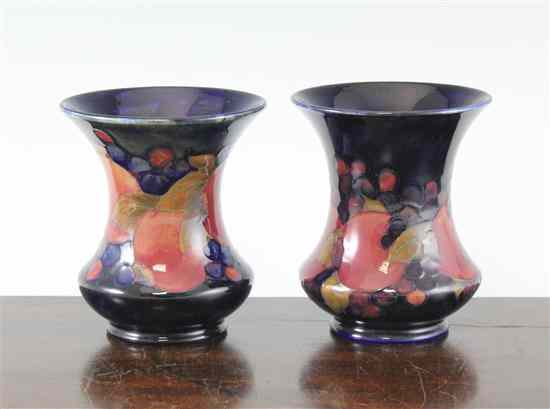 Appraisal: A pair of Moorcroft Pomegranate pattern vases c - each