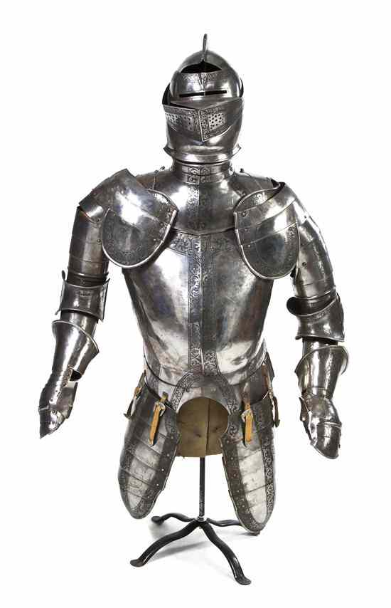 Appraisal: A Continental Steel Suit of Armor having areas of engraved