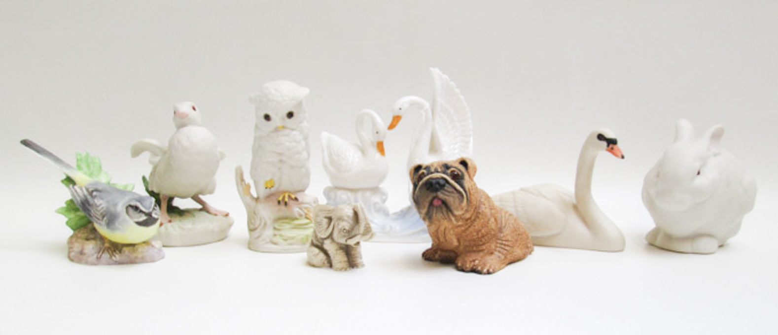 Appraisal: EIGHT BISQUE PORCELAIN AND PLASTIC ANIMAL FIGURES including a Royal