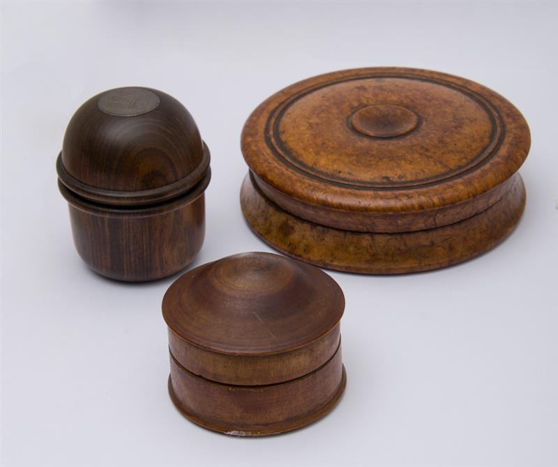 Appraisal: THREE TREENWARE BOXES One burrwood of disc-form with part tortoise-lined