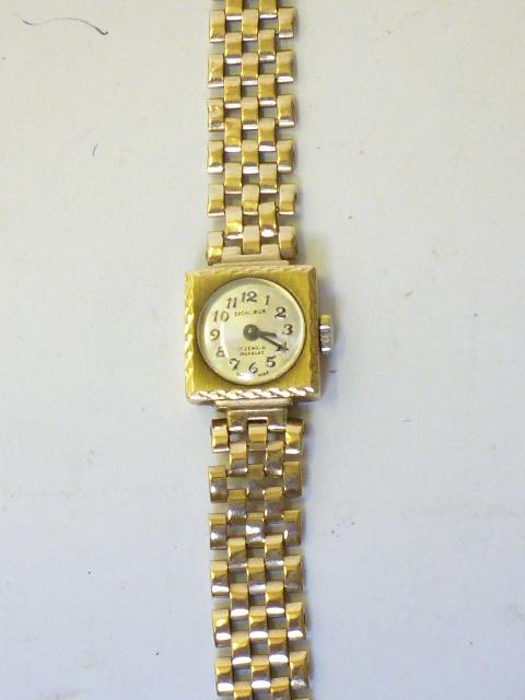 Appraisal: A LADY'S CT GOLD EXCALIBER WRISTWATCH the circular silvered dial