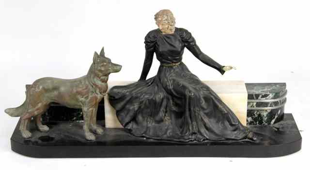 Appraisal: An Art Deco spelter and faux ivory figure group modelled