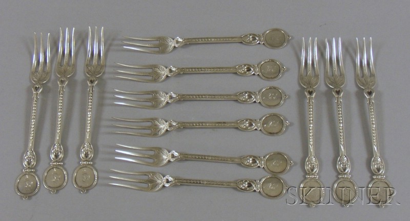 Appraisal: Twelve Coin Silver Cocktail Forks th century with circular finial