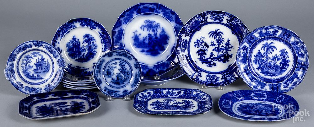 Appraisal: Fourteen flow blue porcelain plates and platters Fourteen flow blue