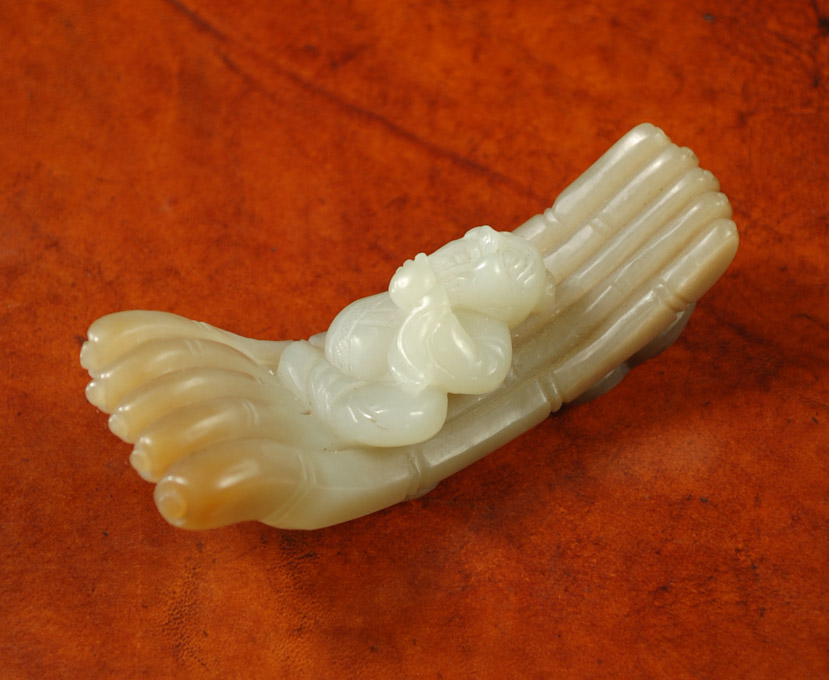 Appraisal: JADE CARVED FIGURAL PAINT BRUSH REST featuring a seated elder