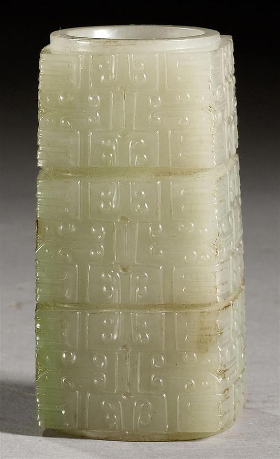 Appraisal: A GREYISH PALE CELADON JADE CONG DELICATELY CARVED WITH ARCHAIC