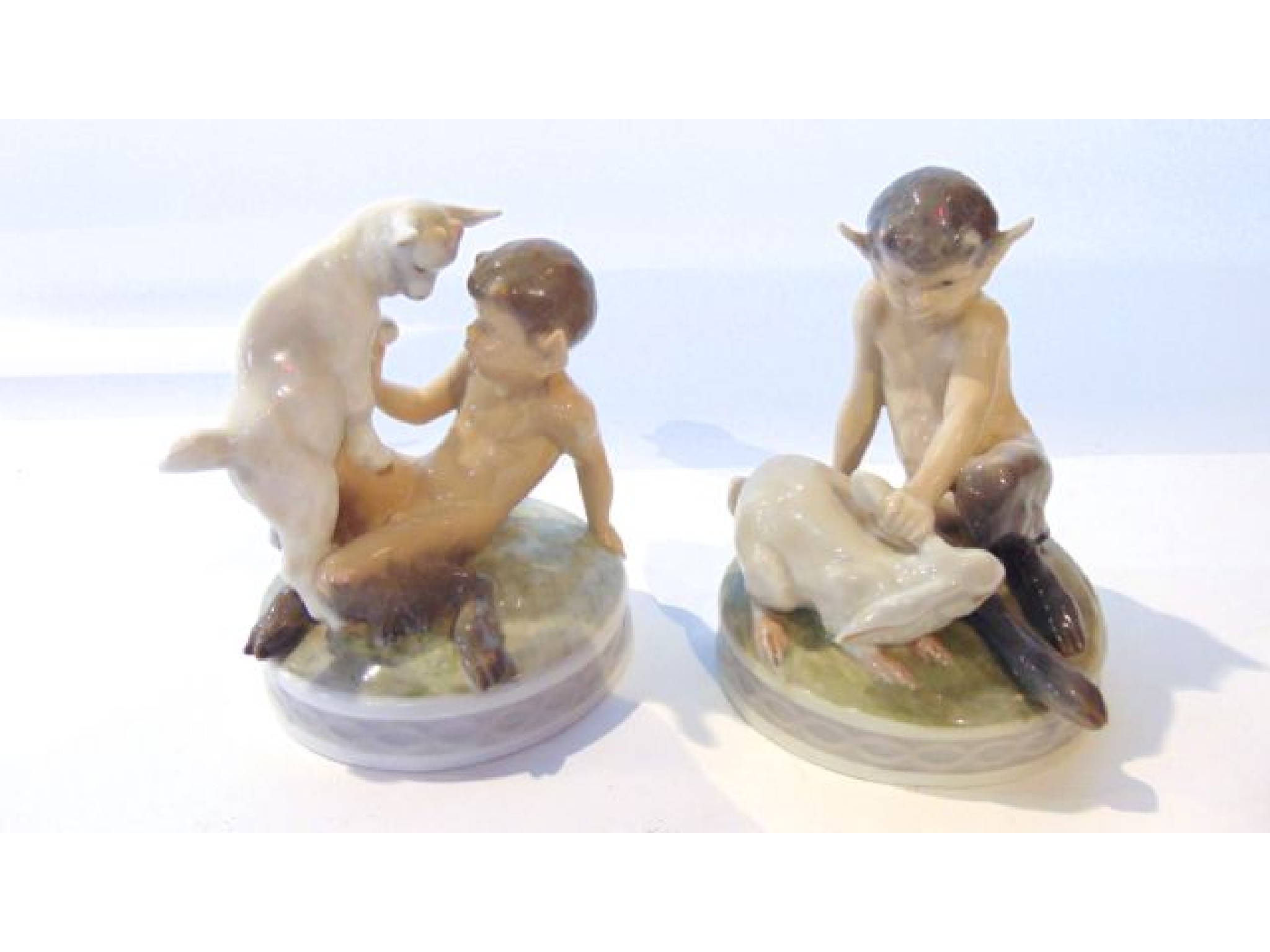 Appraisal: A pair of Royal Copenhagen models of fauns one pulling