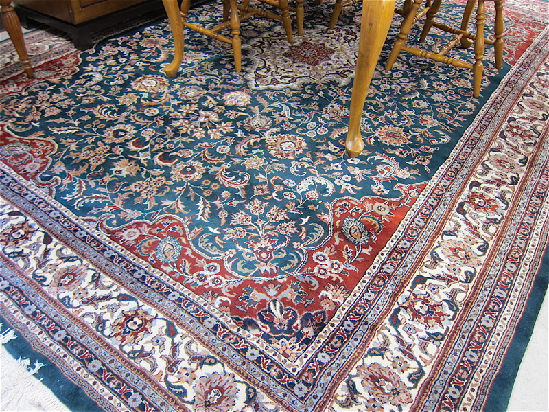 Appraisal: HAND KNOTTED ORIENTAL CARPET Indo-Persian floral and central floral medallion