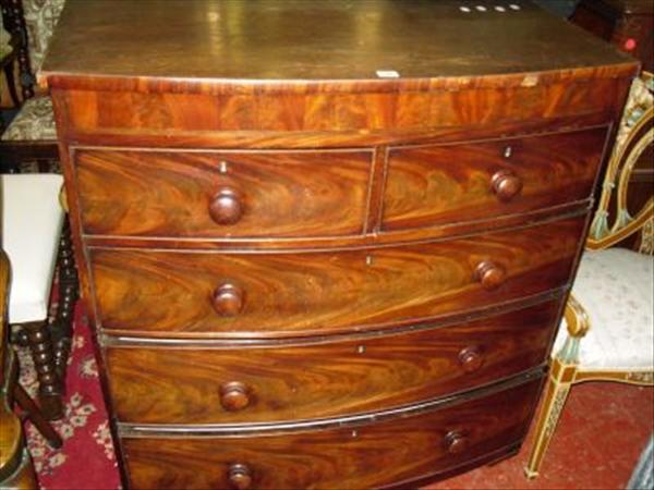 Appraisal: A bowfront chest of two short and three long drawers