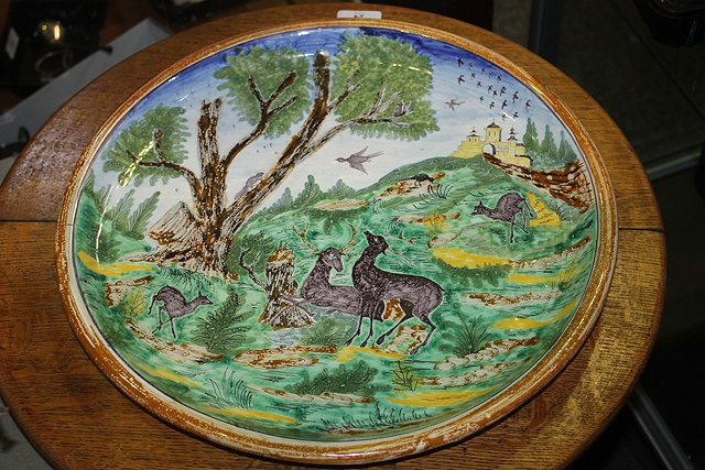 Appraisal: AN ITALIAN MAIOLICA POLYCHROME LARGE CHARGER stags in a classical