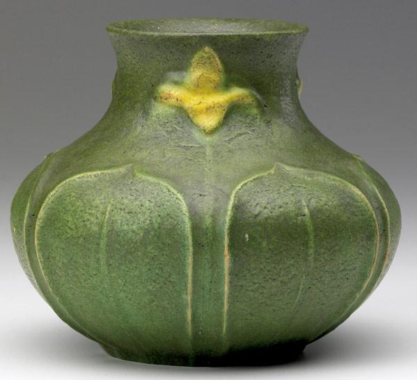 Appraisal: GRUEBY Gourd-shaped vase with yellow-glazed daffodils alternating with green leaves