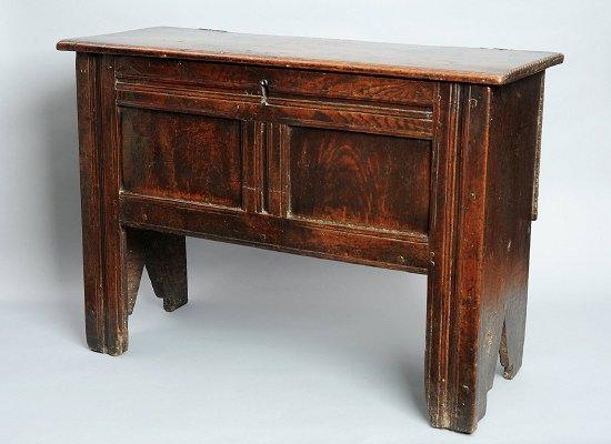 Appraisal: A late th Century oak chest with plain rectangular pin