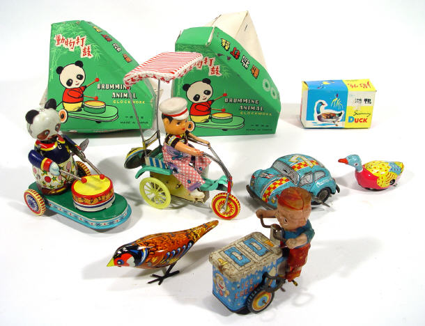 Appraisal: Six Chinese tinplate toys including two boxed drumming pandas