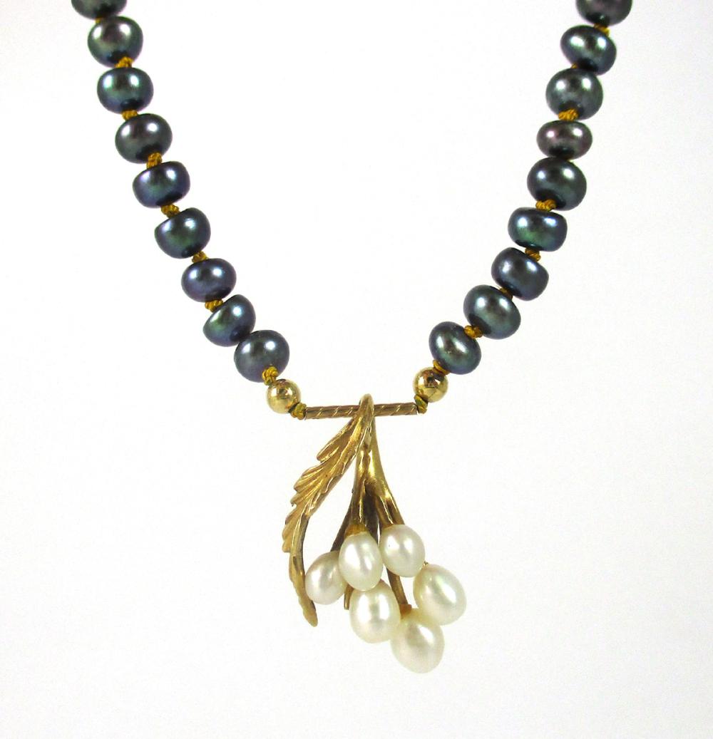 Appraisal: BLACK AND WHITE PEARL AND YELLOW GOLD NECKLACE - hand-knotted