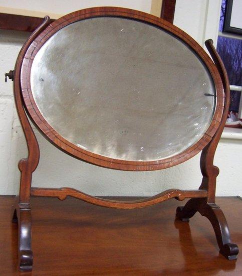 Appraisal: A th Century mahogany framed oval swing mirror a lacquer