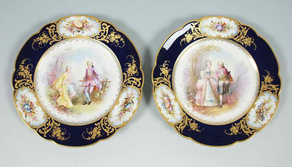 Appraisal: TWO SEVRES ARTIST SIGNED CABINET PLATES Cobalt borders with musical