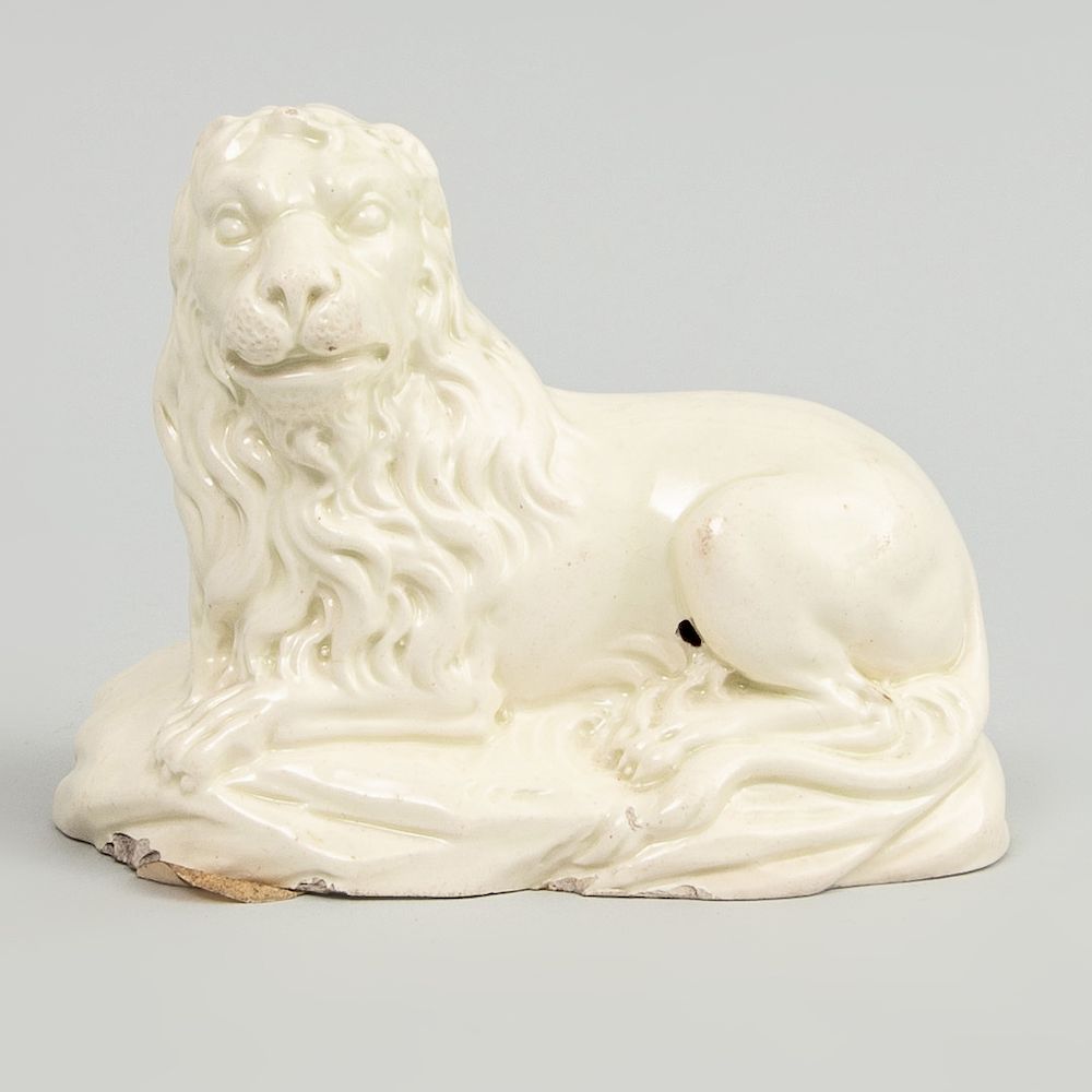 Appraisal: Staffordshire Creamware Model of a Recumbent Lion With jelly label