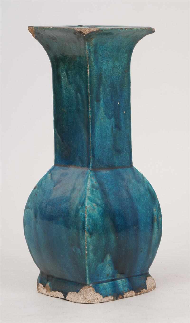 Appraisal: PERSIAN TURQUOISE-GLAZED POTTERY VASE Of angular baluster-form with everted rim