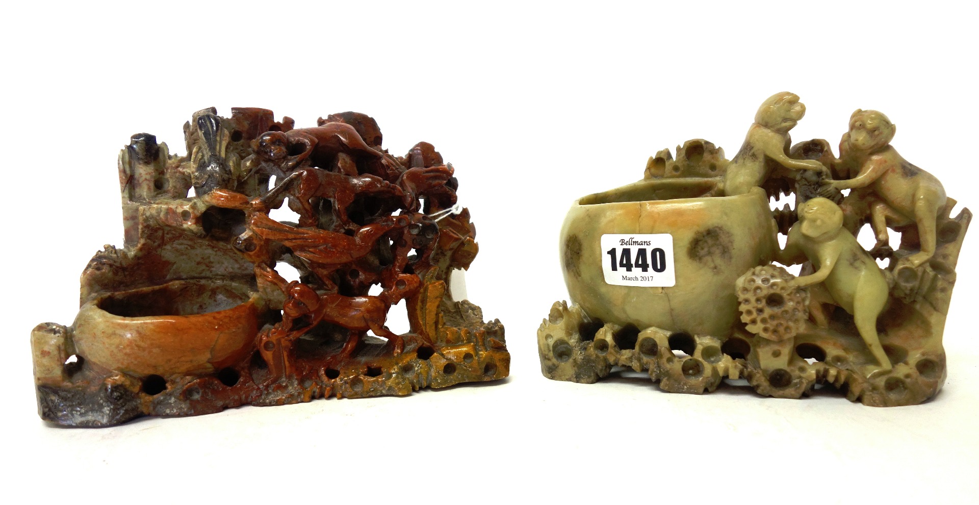 Appraisal: Two Chinese soapstone groups late th th century carved with