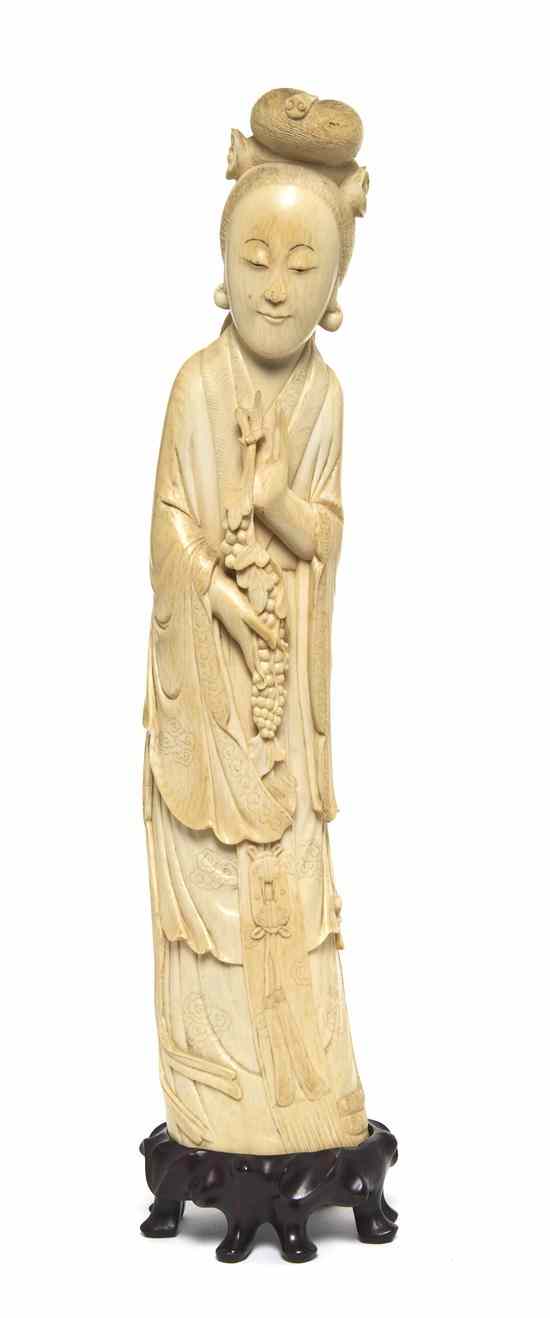 Appraisal: A Chinese Carved Ivory Figure of a Lady shown with